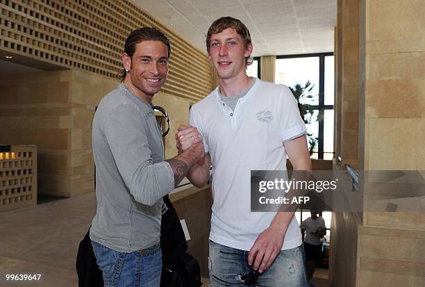 Players of the German national football team goalkeeper Tim Wiese greets striker Stefan Kiessling on May 17, 2010 as he arrives in Sciacca, Sicily,...