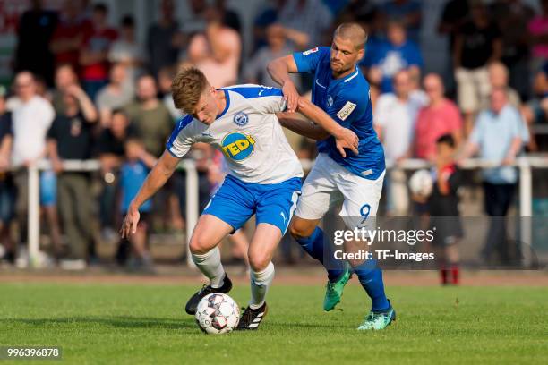 Hendrik Brauer of Bruenninghausen and Johannes Wurtz of Bochum battle for the ball during the Friendly match between FC Bruenninghausen and VfL...