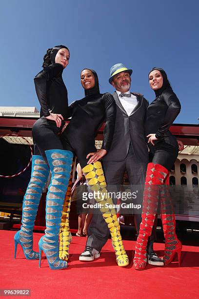 Designer Christian Louboutin and The Loubi's Angels attend 'Le Carrosse Noir And The Loubi's Angels' presented by Christian Louboutin at Palm Beach...