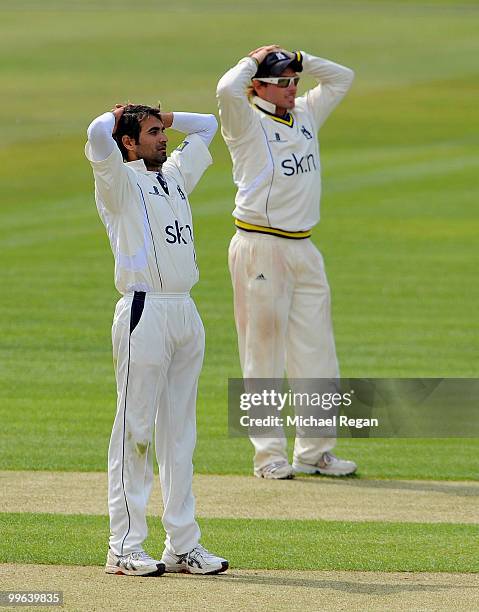 Imran Tahir and Ian Bell of Warwickshire look dejected during the LV County Championship match between Warwickshire and Lancashire at Edgbaston at...