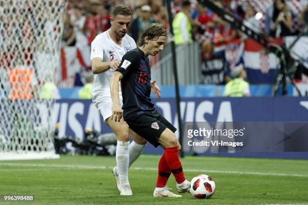 Jordan Henderson of England, Luka Modric of Croatia during the 2018 FIFA World Cup Russia Semi Final match between Croatia and England at the...