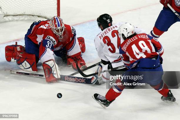 Mats Zuccarello Aasen of Norway watches goalkeeper Pal Grotnes make a save against Ivo Ruthemann of Switzerland during the IIHF World Championship...