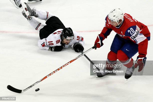 Anders Bastiansen of Norway eludes Andreas Ambuhl of Switzerland during the IIHF World Championship group F qualification round match between Norway...