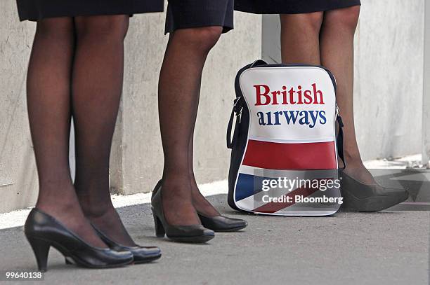 British Airways employees stand outside Terminal 5 at Heathrow airport in London, U.K., on Monday, May 17, 2010. British Airways Plc and the Unite...