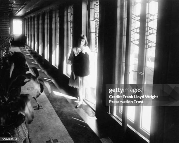 South hall looking east with Jeannette Wilber standing in doorway to the south balcony, Chicago, Illinois, 1916.