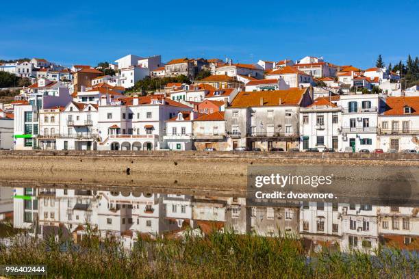 view of city alcacer do sal near the river sado in portugal - alcacer stock pictures, royalty-free photos & images