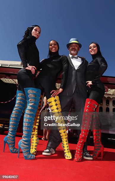 Designer Christian Louboutin and The Loubi's Angels attend 'Le Carrosse Noir And The Loubi's Angels' presented by Christian Louboutin at Palm Beach...