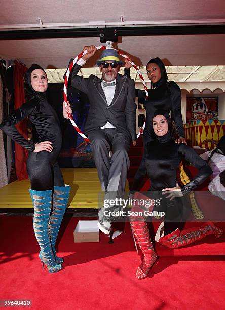 Designer Christian Louboutin and The Loubi's Angels attend 'Le Carrosse Noir And The Loubi's Angels' presented by Christian Louboutin at Palm Beach...