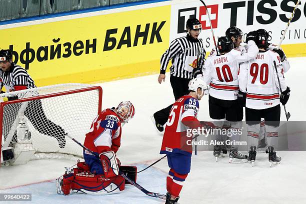 Thibaut Monnet of Switzerland celebrates his team's first goal with team mates during the IIHF World Championship group F qualification round match...