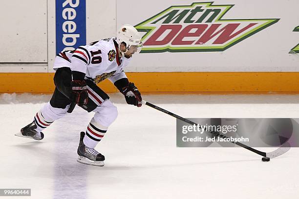 Patrick Sharp of the Chicago Blackhawks moves the puck while taking on the San Jose Sharks in Game One of the Western Conference Finals during the...