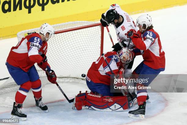 Thibaut Monnet of Switzerland scores his team's first goal against Ole-Kristian Tollefsen, goalkeeper Pal Grotnes and Kristian Forsberg of Norway...