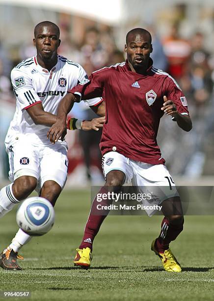 Omar Cummings of the Colorado Rapids fights for a loose ball with Kwame Watson-Siriboe of the Chicago Fire during the second half at Dick's Sporting...