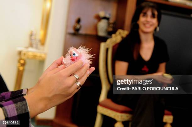 Representatives for Latin America of "La Maleta Roja" company, promote sex toys in Montevideo, Uruguay, on May 15, 2010. The Spanish company,...