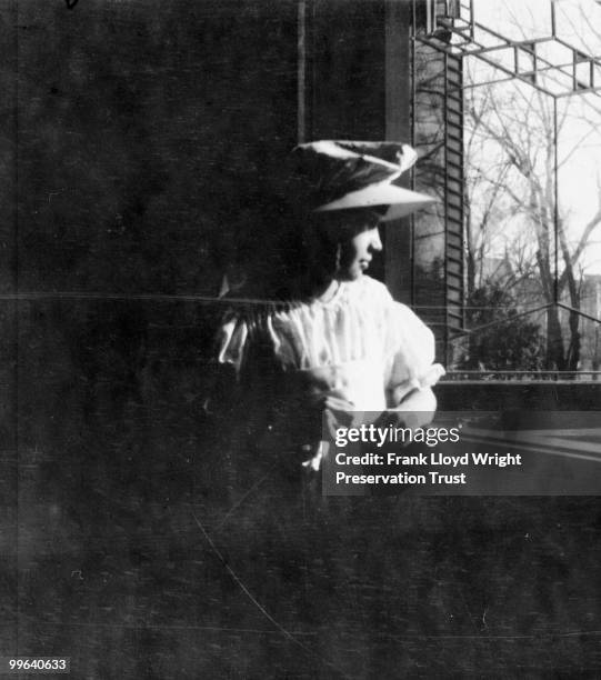 Jeannette Wilber, daughter of the third homeowners, at a window in the dining room, Chicago, Illinois, 1916.