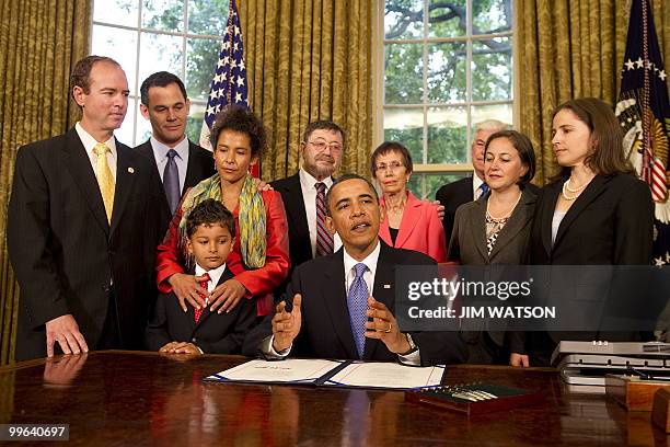 President Barack Obama makes remarks before signing the Freedom of the Press Act in the Oval Office of the White House in Washington, DC, May 17,...