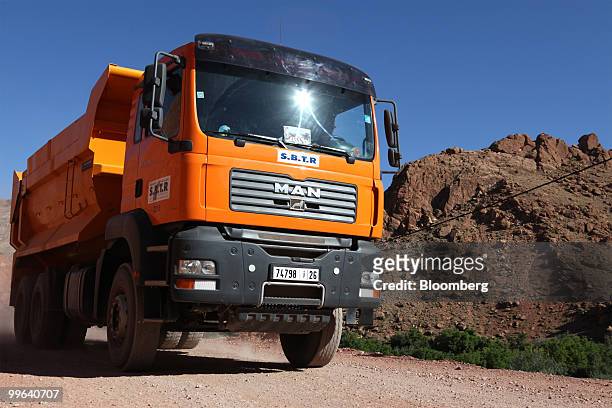 An MAN SE truck passes down a dirt mountain road near El-Kelaat M'Gouna, Morocco, on Thursday, May 13, 2010. MAN SE may increase commercial-vehicle...