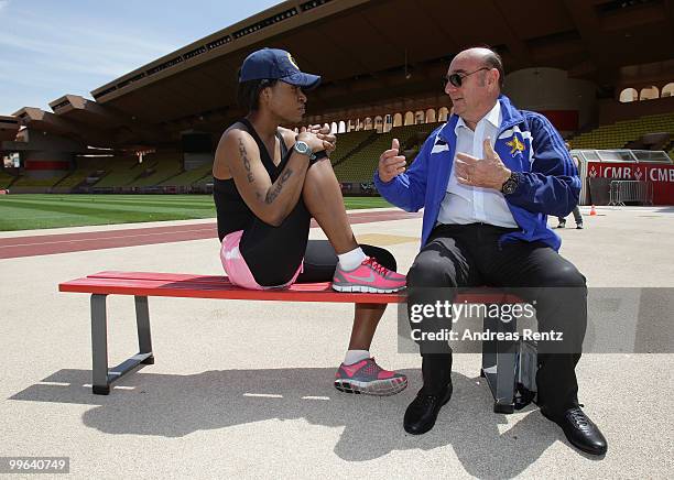 Suzanne 'Africa' Engo prepares to run under the supervision of her coach Elio Locatelli, IAAF Director, at the Stade Louis II on May 17, 2010 in...