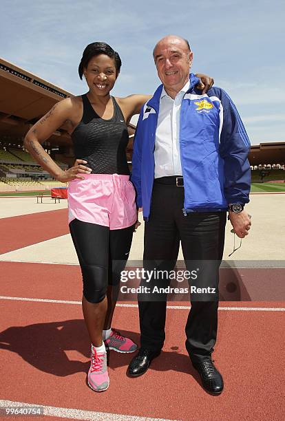 Suzanne 'Africa' Engo prepares to run under the supervision of her coach Elio Locatelli, IAAF Director, at the Stade Louis II on May 17, 2010 in...