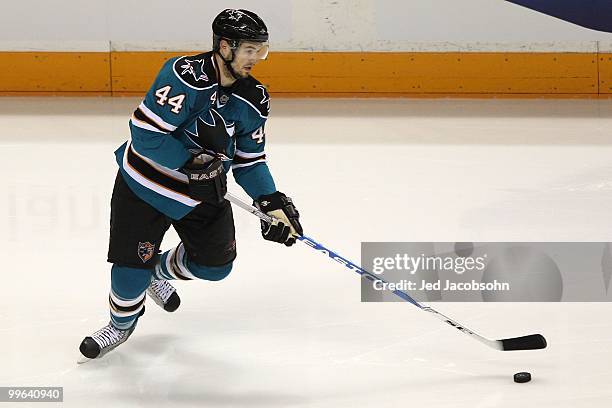 Marc-Edouard Vlasic of the San Jose Sharks moves the puck while taking on the Chicago Blackhawks in Game One of the Western Conference Finals during...