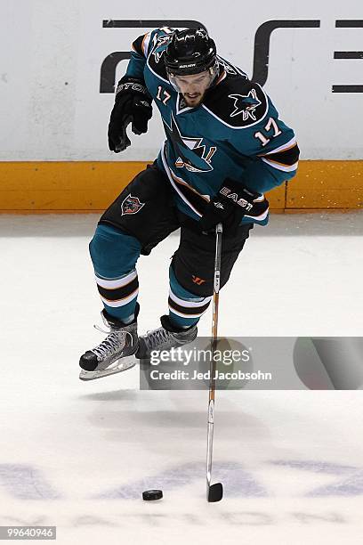 Torrey Mitchell of the San Jose Sharks moves the puck while taking on the Chicago Blackhawks in Game One of the Western Conference Finals during the...