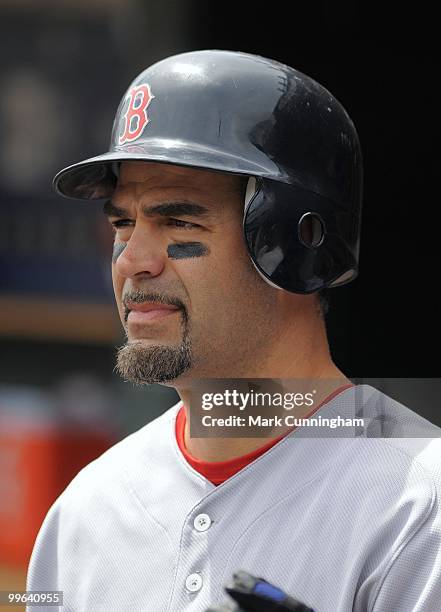 Mike Lowell of the Boston Red Sox looks on from the dugout against the Detroit Tigers during the game at Comerica Park on May 16, 2010 in Detroit,...