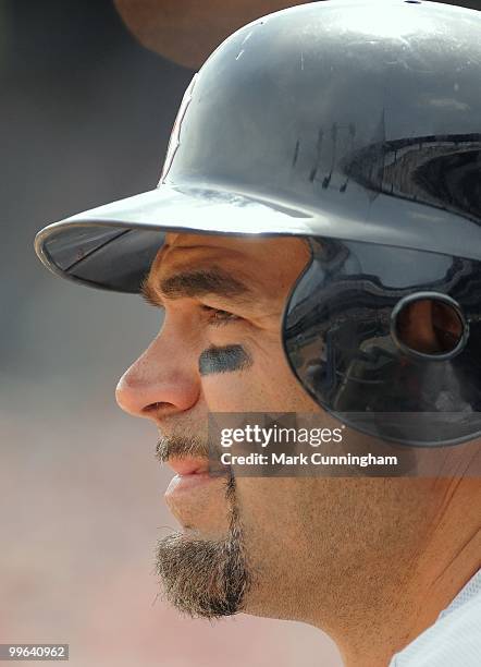 Mike Lowell of the Boston Red Sox looks on from the dugout against the Detroit Tigers during the game at Comerica Park on May 16, 2010 in Detroit,...