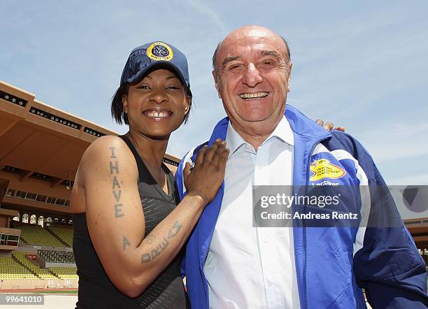 Suzanne 'Africa' Engo prepares to run under the supervision of her coach Elio Locatelli, IAAF Director, at the Stade Louis II on May 17, 2010 in...