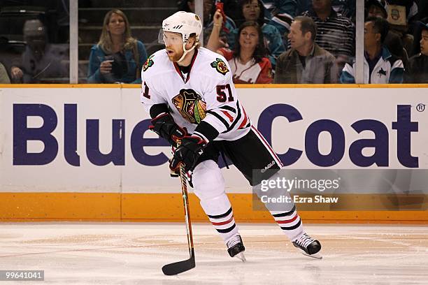 Brian Campbell of the Chicago Blackhawks moves the puck while taking on the San Jose Sharks in Game One of the Western Conference Finals during the...