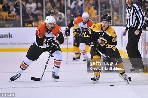Vladimir Sobotka of the Boston Bruins skates after the puck against Blair Betts of the Philadelphia Flyers in Game Seven of the Eastern Conference...