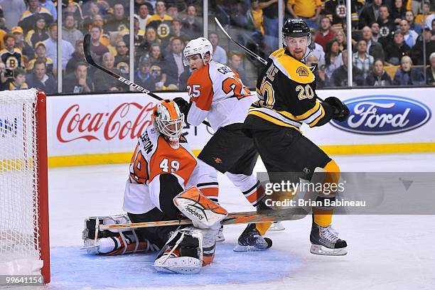Daniel Paille of the Boston Bruins watches the loose puck against Matt Carle and Michael Leighton of the Philadelphia Flyers in Game Seven of the...