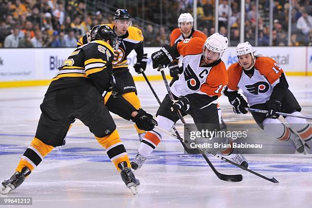 Mike Richards of the Philadelphia Flyers skates with the puck against the Boston Bruins in Game Seven of the Eastern Conference Semifinals during the...