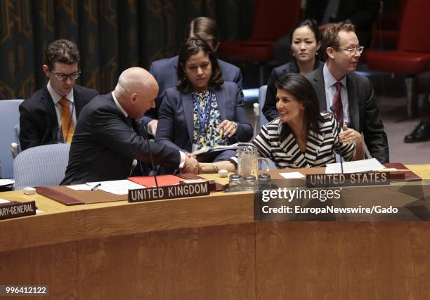 United States Ambassador Nikki Haley smiles and shakes hands with a representative of the United Kingdom at the United Nations, New York City, New...