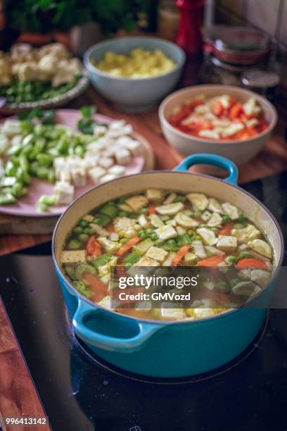 preparing delicious minestrone soup with fresh vegetables - gmvozd stock pictures, royalty-free photos & images