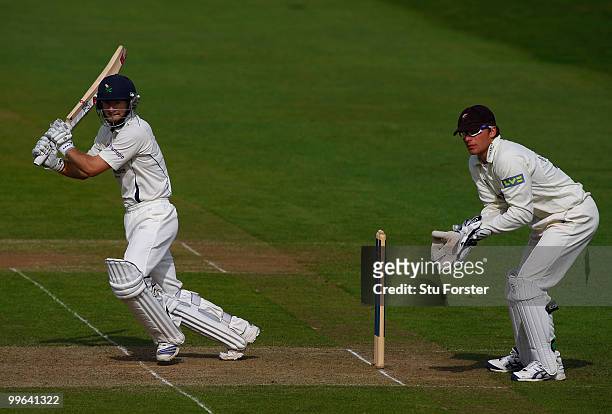 Yorkshire batsman Adam Lyth cuts a ball towards the boundary watched by Somerset wicketkeeper Jos Buttler during day one of the LV County...
