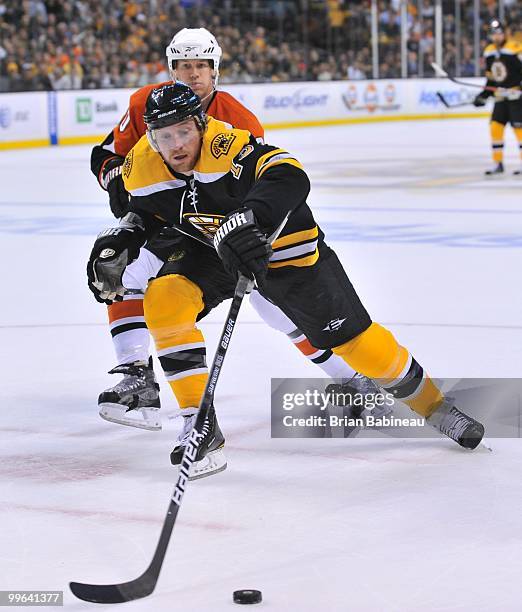 Michael Ryder of the Boston Bruins reaches for the puck against the Philadelphia Flyers in Game Seven of the Eastern Conference Semifinals during the...