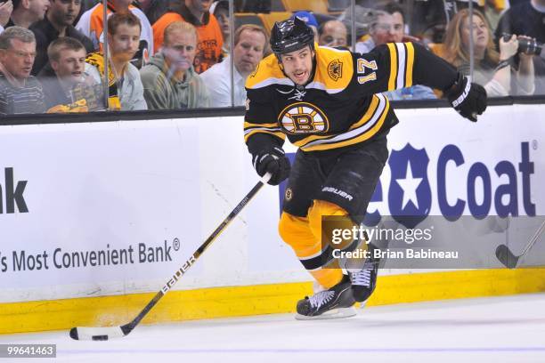 Milan Lucic of the Boston Bruins skates up the ice with the puck against the Philadelphia Flyers in Game Seven of the Eastern Conference Semifinals...