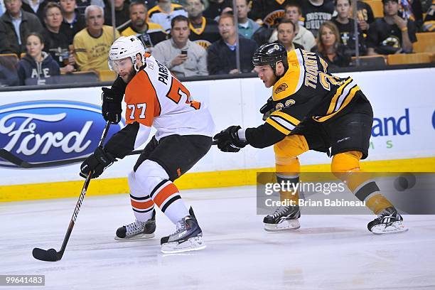 Ryan Parent of the Philadelphia Flyers skates with the puck against Shawn Thornton of the Boston Bruins in Game Seven of the Eastern Conference...