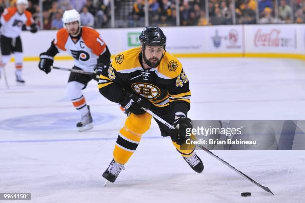 Mark Stuart of the Boston Bruins skates with the puck against the Philadelphia Flyers in Game Seven of the Eastern Conference Semifinals during the...
