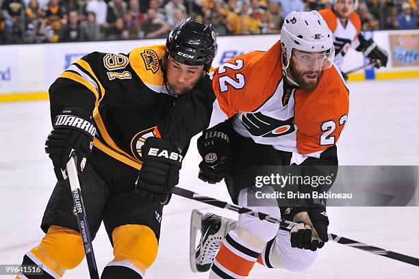 Marc Savard of the Boston Bruins checks against Ville Leino of the Philadelphia Flyers in Game Seven of the Eastern Conference Semifinals during the...