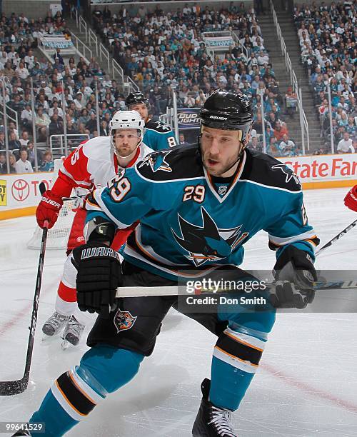 Ryane Clowe of the San Jose Sharks skates as Niklas Kronwall of the Detroit Red Wings pursues in Game Five of the Western Conference Semifinals...