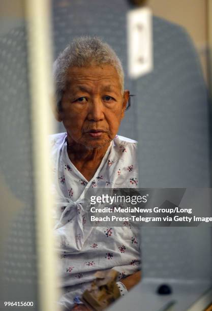 Thomas Kim sits in a hospital gown in a wheelchair as his arraignment is postponed in Superior Court in Long Beach on Monday, July 9, 2018. Kim, the...