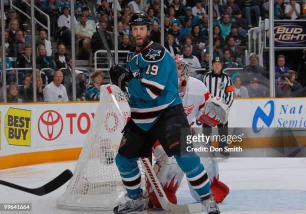 Joe Thornton of the San Jose Sharks stands in front of Jimmy Howard of the Detroit Red Wings in Game Five of the Western Conference Semifinals during...