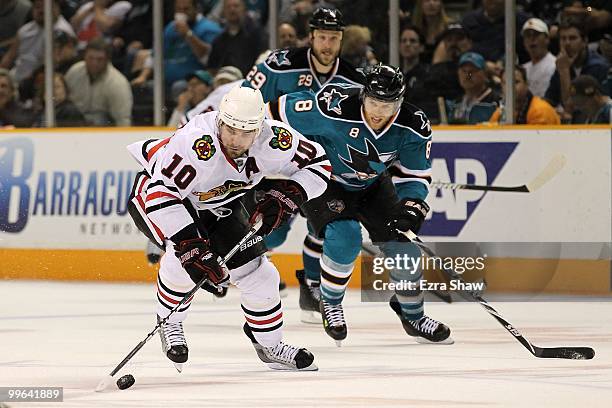 Patrick Sharp of the Chicago Blackhawks moves the puck in front of Joe Pavelski of the San Jose Sharks in Game One of the Western Conference Finals...