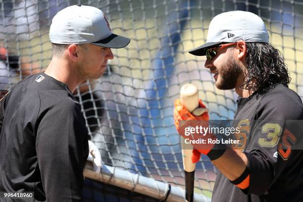 Buster Posey and Brandon Crawford of the San Francisco Giants talk before the game against the Los Angeles Dodgers at Dodger Stadium on Thursday,...