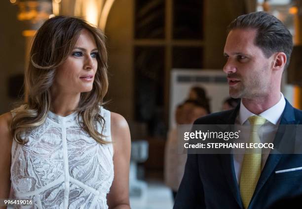 First Lady Melania Trump and Husband of Luxembourg's pime minister Gauthier Destenay are pictured ahead of NATO spouses dinner at Jubilee Museum in...