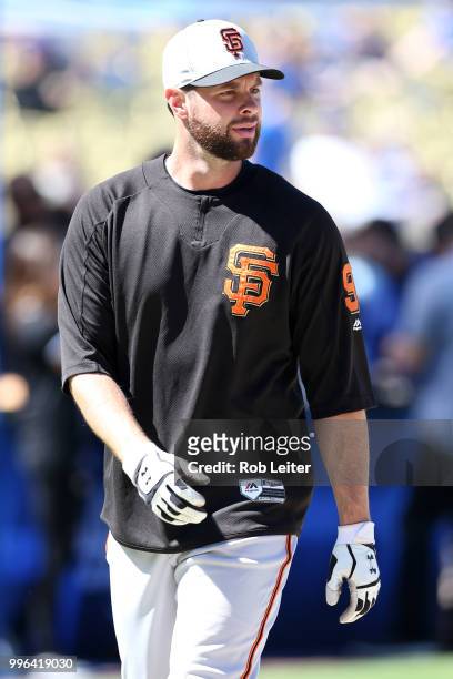 Brandon Belt of the San Francisco Giants looks on before the game against the Los Angeles Dodgers at Dodger Stadium on Thursday, March 29, 2018 in...
