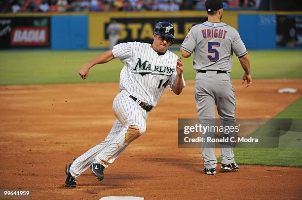 Gaby Sanchez of the Florida Marlins runs to third base during a MLB game against the New York Mets in Sun Life Stadium on May 13, 2010 in Miami,...