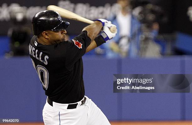 Vernon Wells of the Toronto Blue Jays swings against the Texas Rangers during a MLB game at the Rogers Centre May 15, 2010 in Toronto, Ontario,...