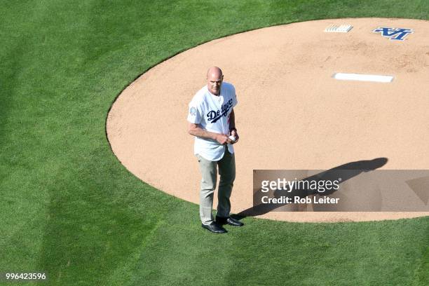 Kirk Gibson throws out the first pitch before the game between the San Francisco Giants and the Los Angeles Dodgers at Dodger Stadium on Thursday,...