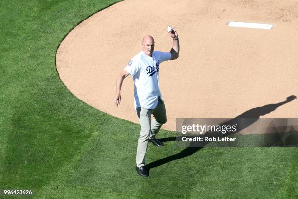 Kirk Gibson throws out the first pitch before the game between the San Francisco Giants and the Los Angeles Dodgers at Dodger Stadium on Thursday,...